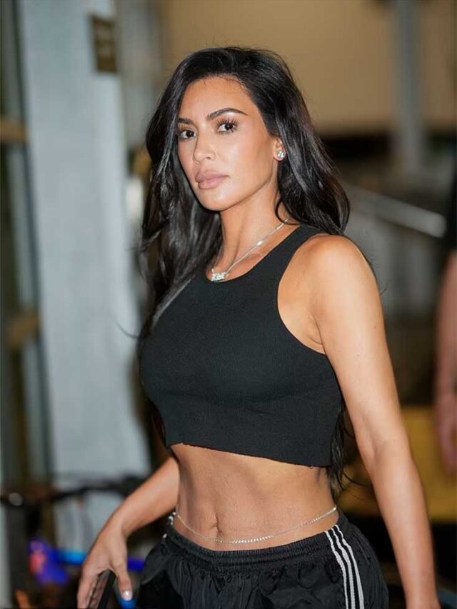 Kim Kardashian shows off her flat midriff in a crop top